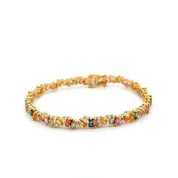 A luxurious 14K gold tennis bracelet featuring 8.15 carats of multi-color sapphires in various shapes (round, oval, emerald, and pear) arranged in a vibrant rainbow pattern, accented with sparkling diamonds for a dazzling and elegant look.